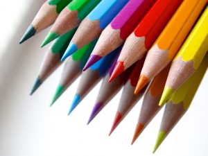 Colored pencils reflected in a mirror