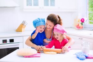 Children baking with their mother